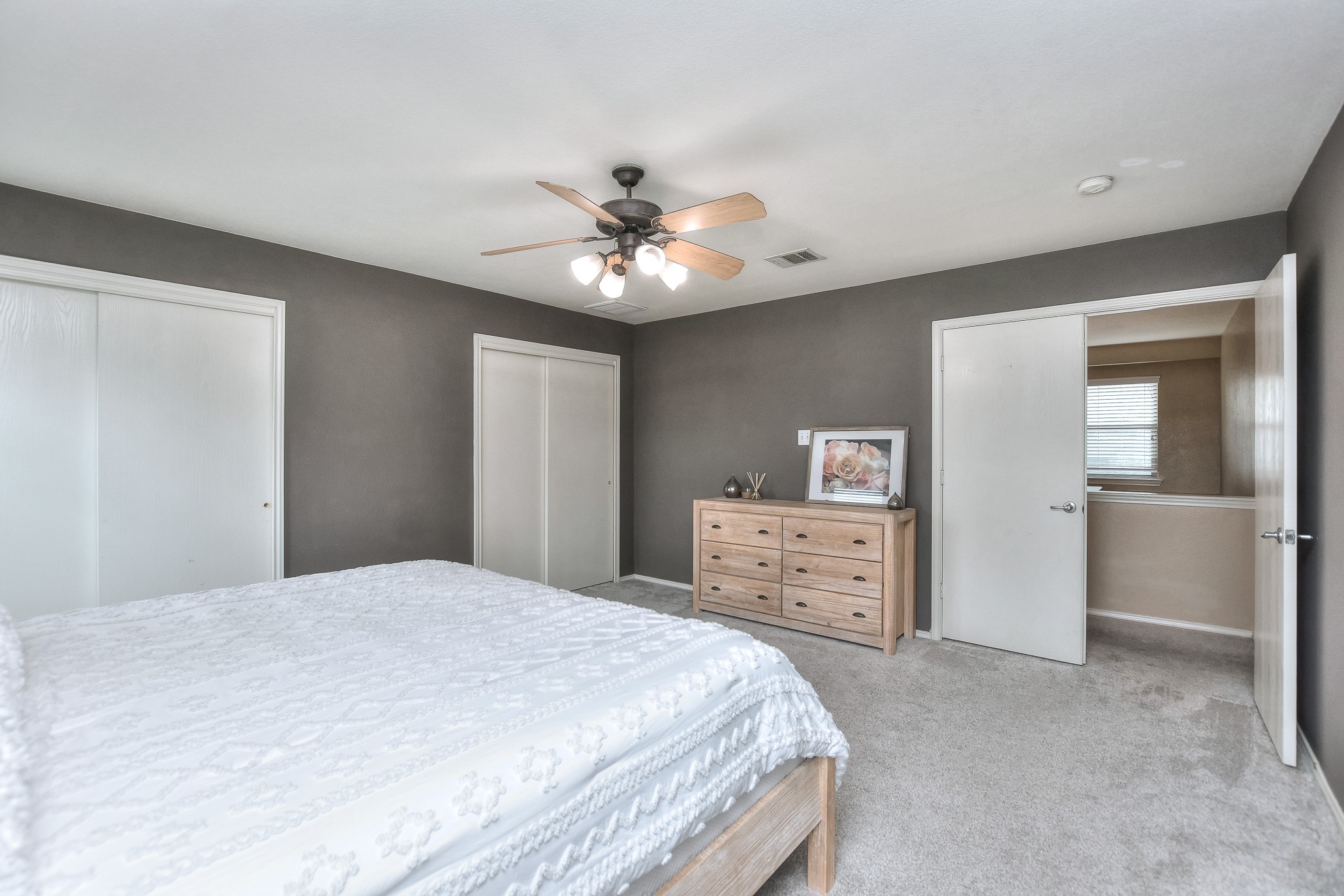 74 Jan Lane Georgetown, TX 78626 - Photo 25 of 31 a bedroom with a bed and a chandelier