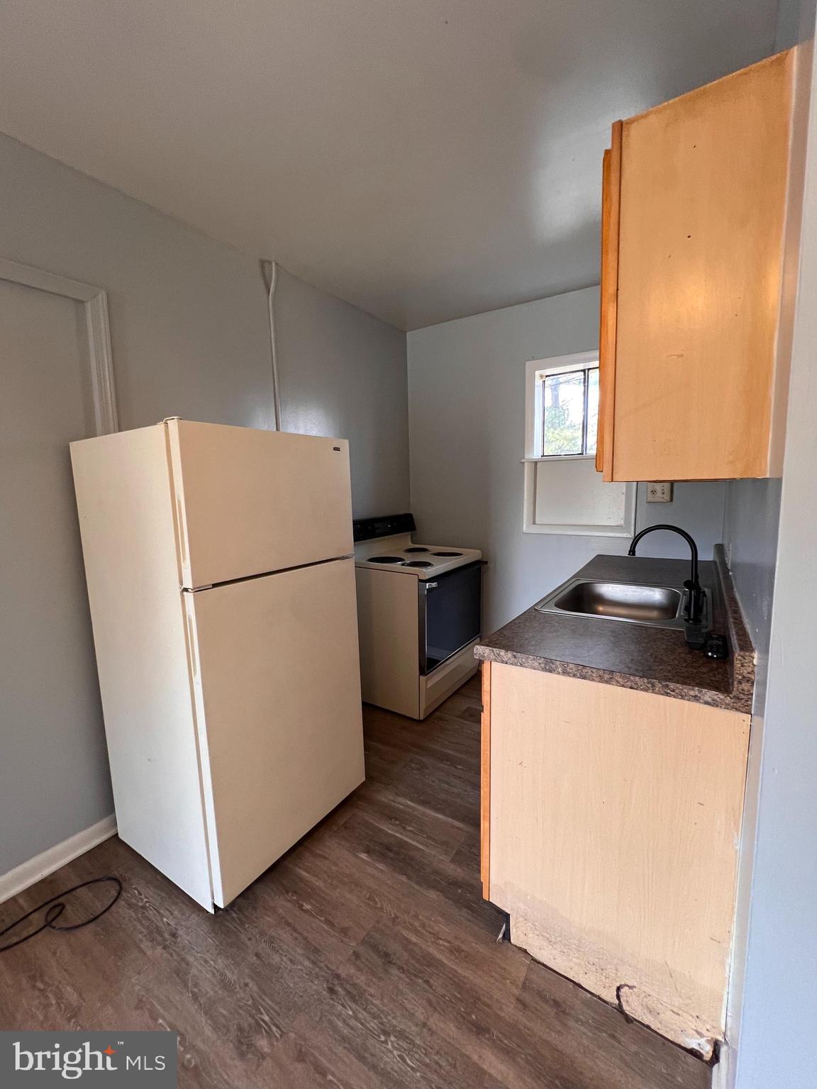 349 Halltown Road, Unit 8 Harpers Ferry, WV 25425 - Photo 2 of 7 a kitchen with a refrigerator sink and wooden floor