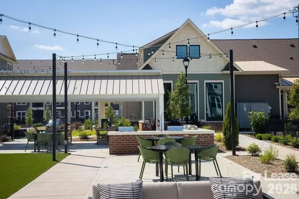 a view of house with outdoor seating