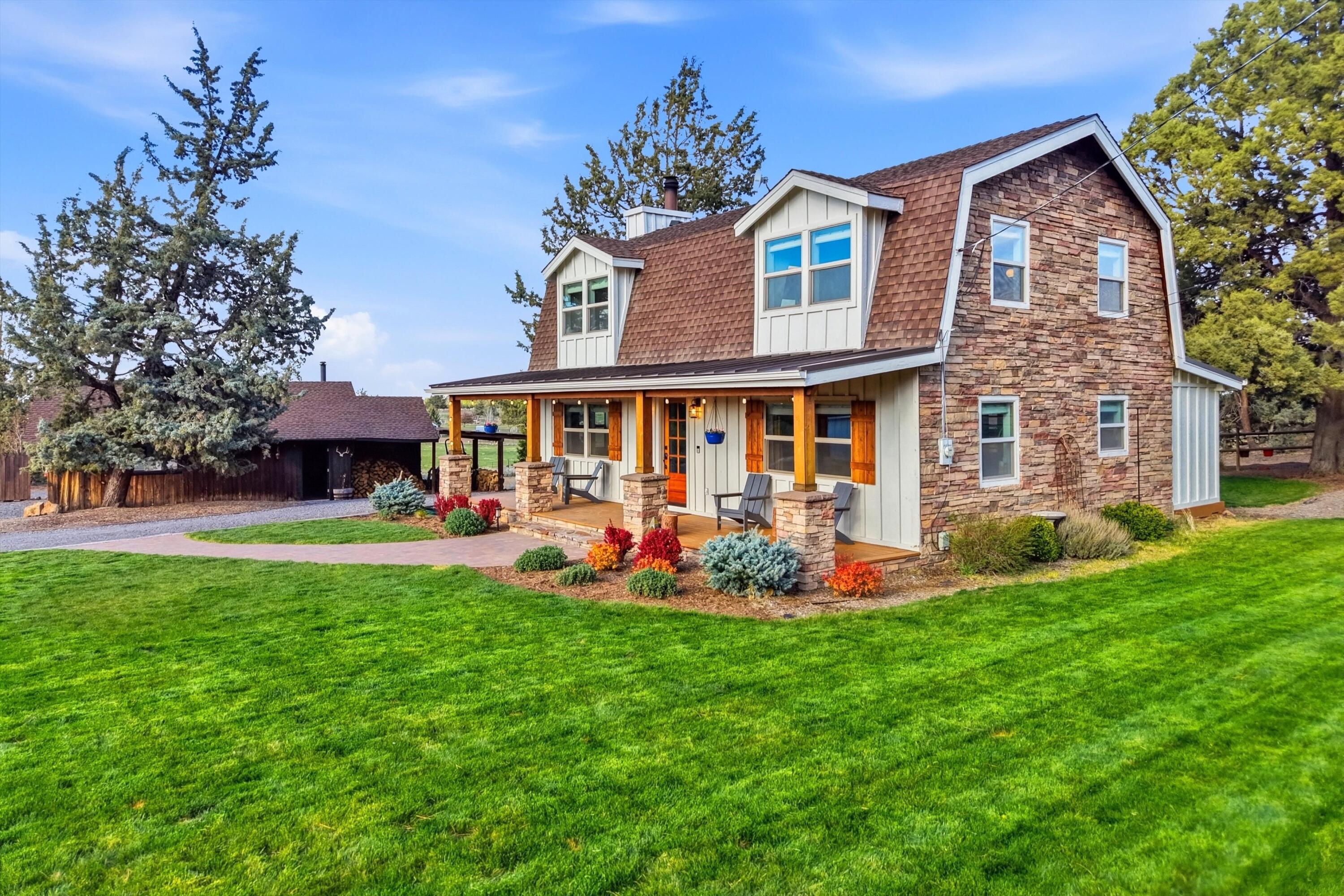 61280 Larsen Road Bend, OR 97702 - Photo 1 of 58 front view of a house with a yard