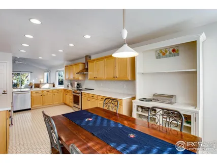 a kitchen view of a dining table chairs and chandelier