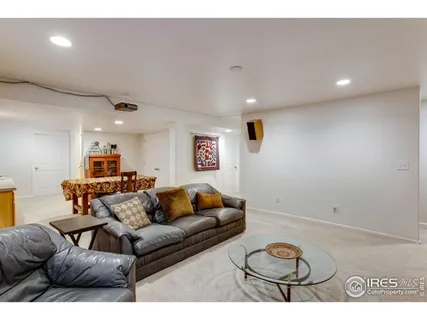 a large kitchen with kitchen island granite countertop a sink and cabinets