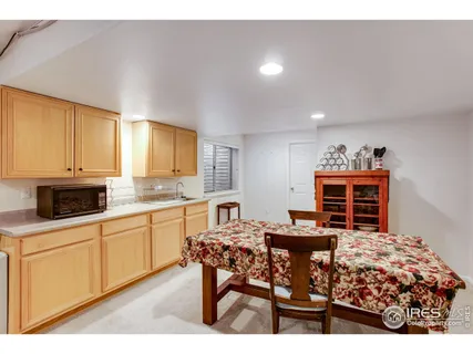 a dining room with a table and chairs