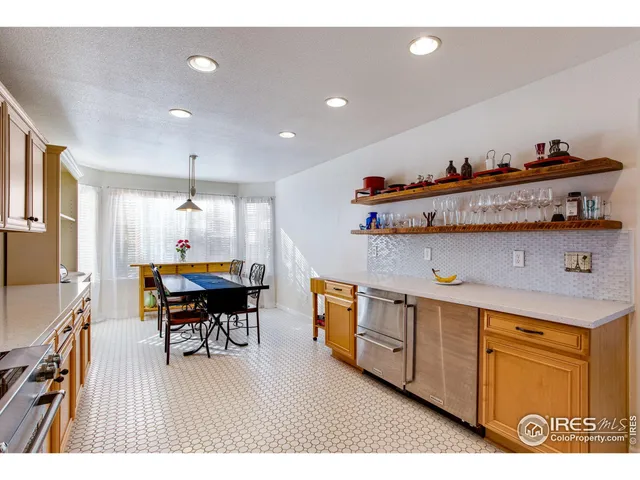 a open kitchen with sink and wooden floor