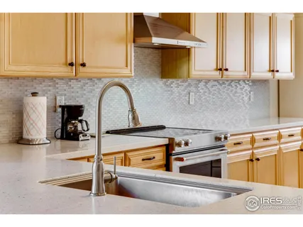 a view of a kitchen with a sink and cabinets