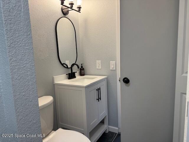 4517 Kaileen Circle Northeast Palm Bay, FL 32905 - Photo 12 of 34 a bathroom with a sink a toilet and a mirror