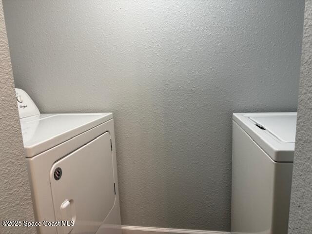 4517 Kaileen Circle Northeast Palm Bay, FL 32905 - Photo 14 of 34 a utility room with dryer and washer