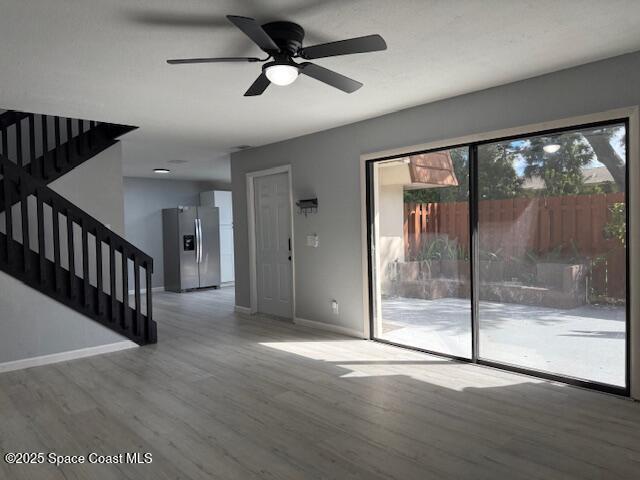 4517 Kaileen Circle Northeast Palm Bay, FL 32905 - Photo 17 of 34 a view of empty room with wooden floor and fan
