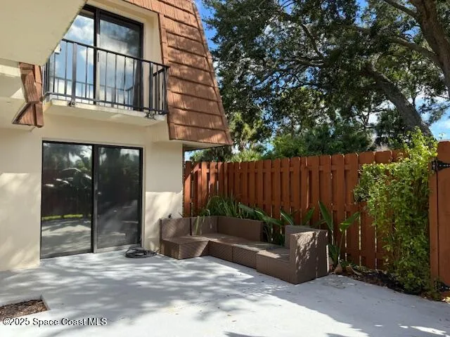 a view of a dinning table and chairs in the patio