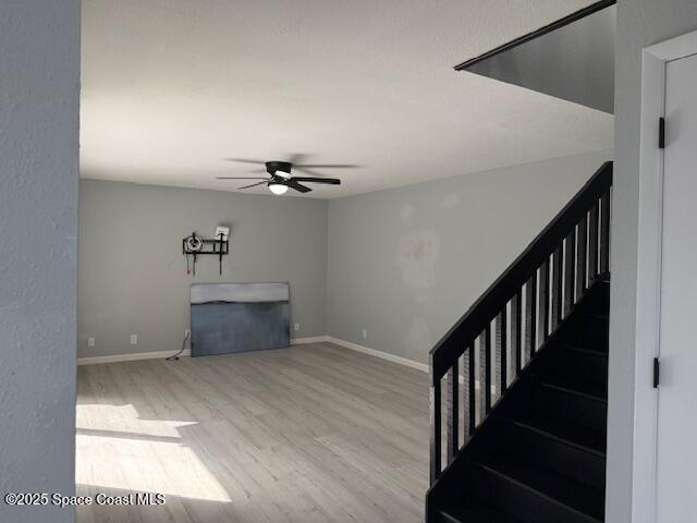 4517 Kaileen Circle Northeast Palm Bay, FL 32905 - Photo 10 of 34 a view of a hallway with wooden floor and staircase
