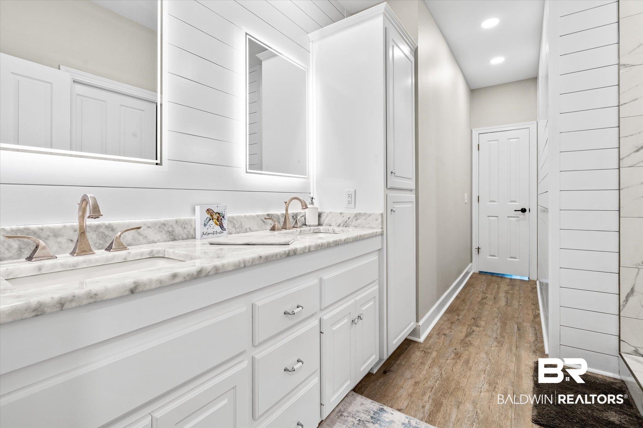 4947 Look Rook Road Orange Beach, AL 36561 - Photo 10 of 24 Full bathroom with baseboards, double vanity, recessed lighting, a sink, and wood finished floors