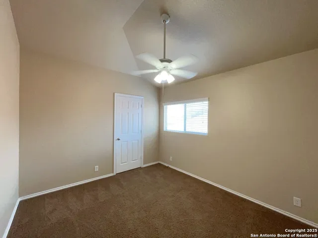 a view of a room with a fan