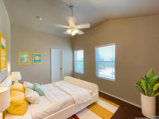 a bedroom with a bed dresser and a window