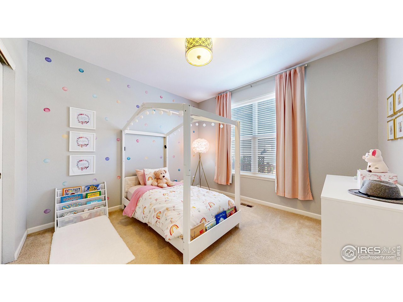 6794 Spring Rain Road Timnath, CO 80547 - Photo 15 of 49 a bedroom with a bed and window