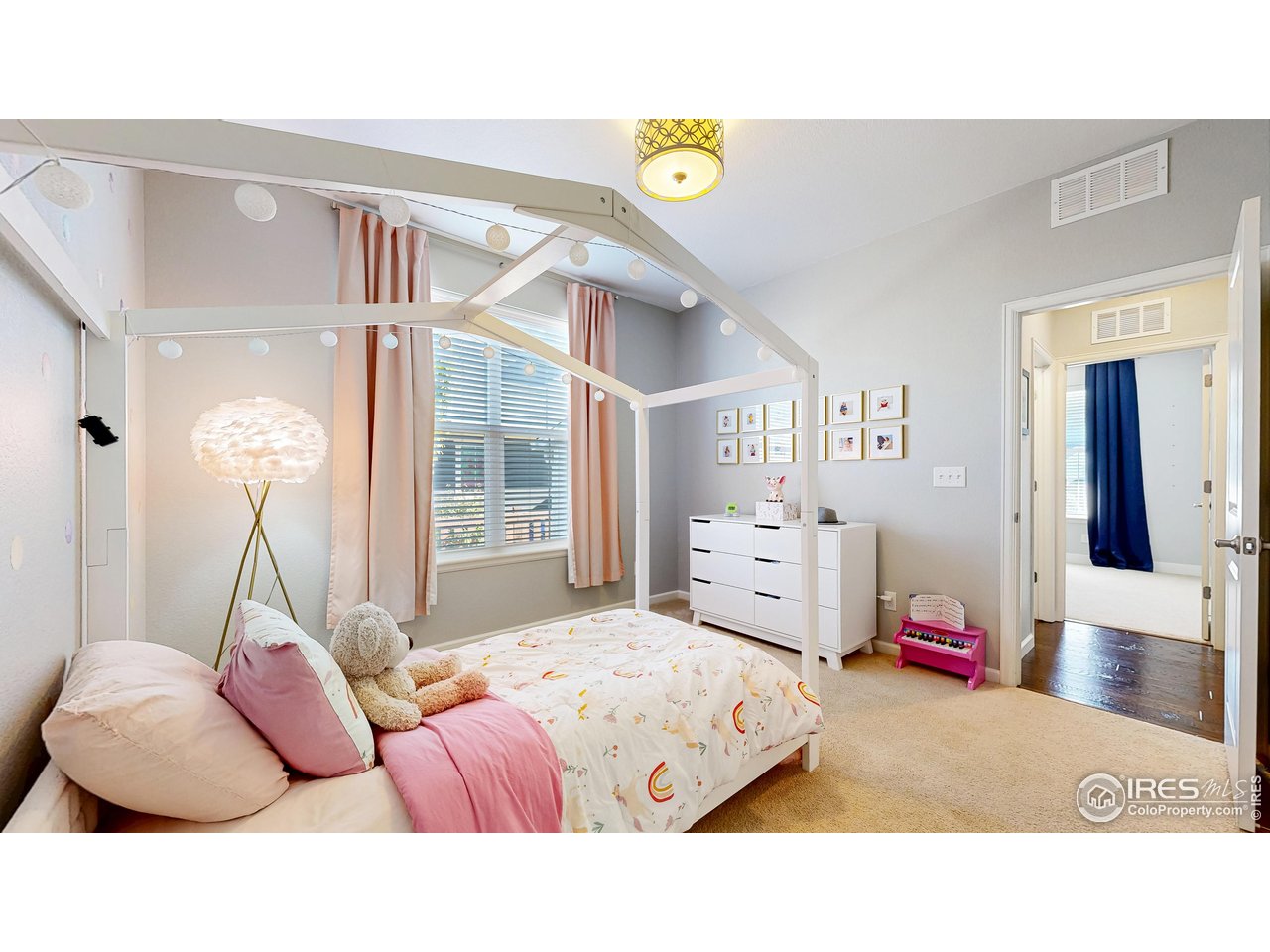 6794 Spring Rain Road Timnath, CO 80547 - Photo 16 of 49 a living room with furniture and a window