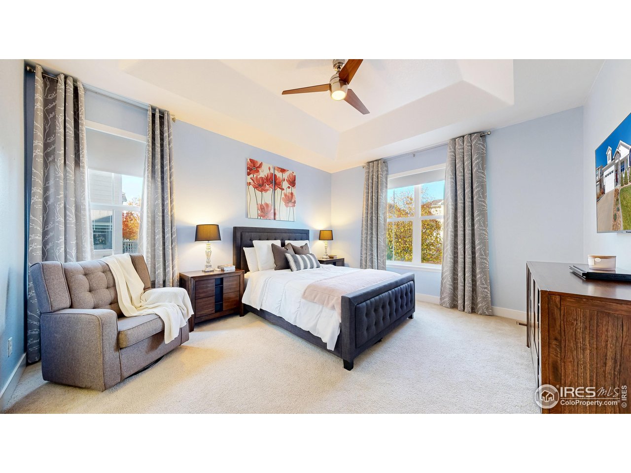 6794 Spring Rain Road Timnath, CO 80547 - Photo 20 of 49 a living room with furniture and a large window