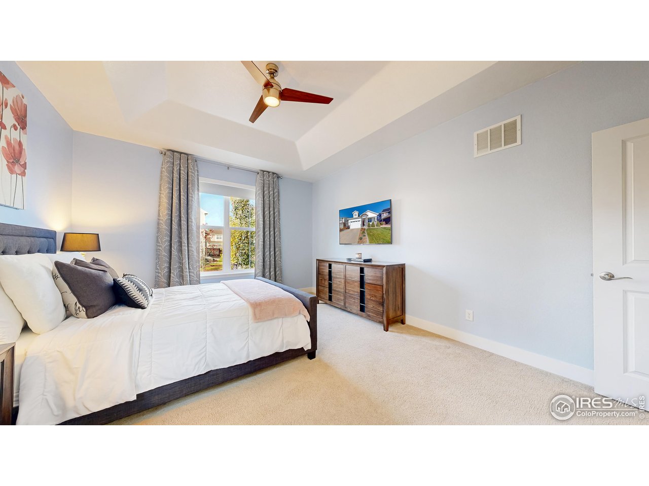 6794 Spring Rain Road Timnath, CO 80547 - Photo 22 of 49 a bedroom with a bed and window