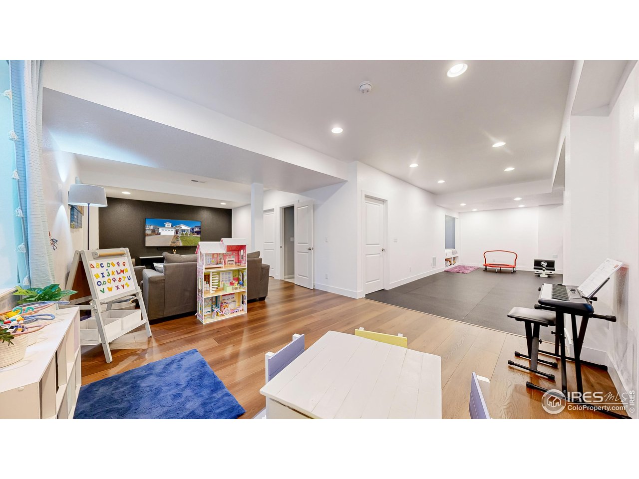 6794 Spring Rain Road Timnath, CO 80547 - Photo 30 of 49 a living room with furniture and kitchen view