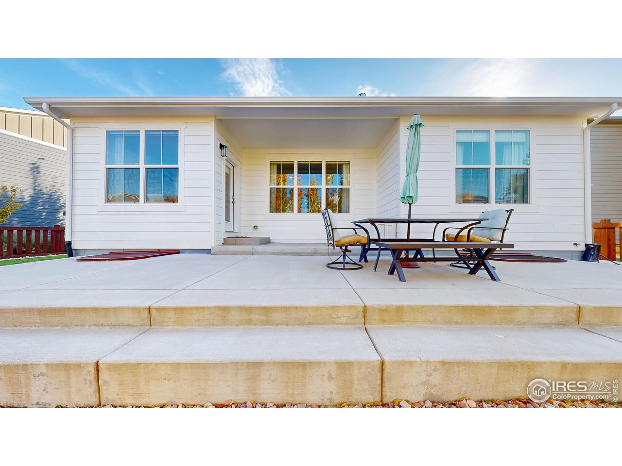 6794 Spring Rain Road Timnath, CO 80547 - Photo 41 of 49 a swimming pool with outdoor seating and a lots of sitting space