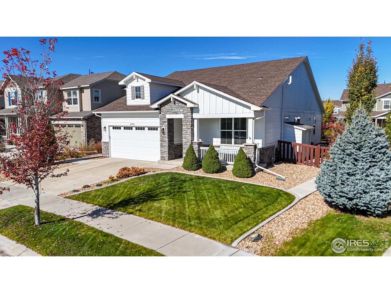 6794 Spring Rain Road Timnath, CO 80547 - Photo 43 of 49 a view of house with yard and outdoor seating