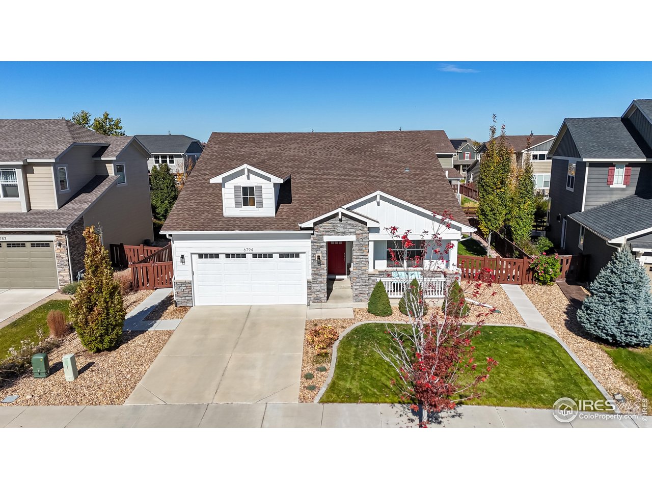 6794 Spring Rain Road Timnath, CO 80547 - Photo 44 of 49 a picture of a house with a yard