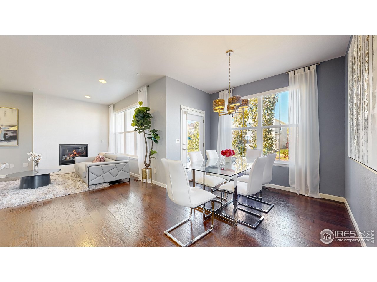 6794 Spring Rain Road Timnath, CO 80547 - Photo 7 of 49 a living room with furniture and a large window
