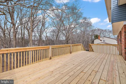 a view of deck with wooden floor and fence