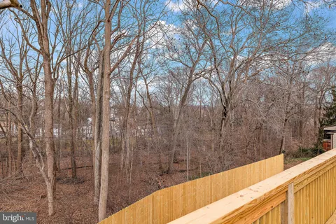 a view of a balcony with trees