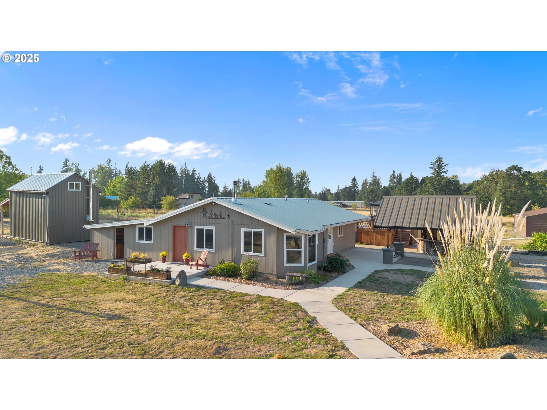 14001 South Union Mills Road Mulino, OR 97042 - Photo 1 of 48 a view of a house with a swimming pool and a yard