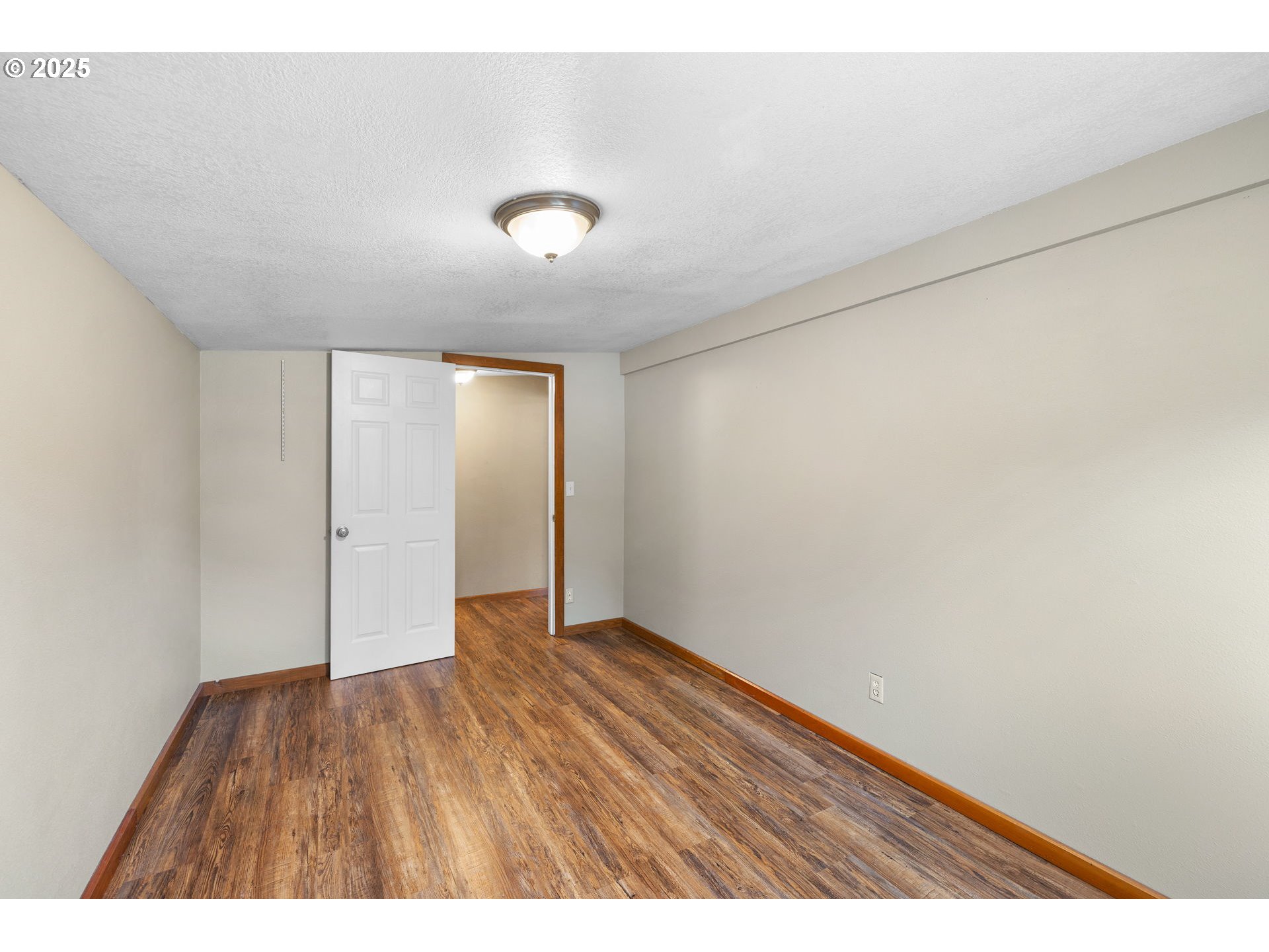 14001 South Union Mills Road Mulino, OR 97042 - Photo 16 of 48 an empty room with wooden floor