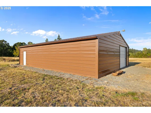 a view of a backyard of the house