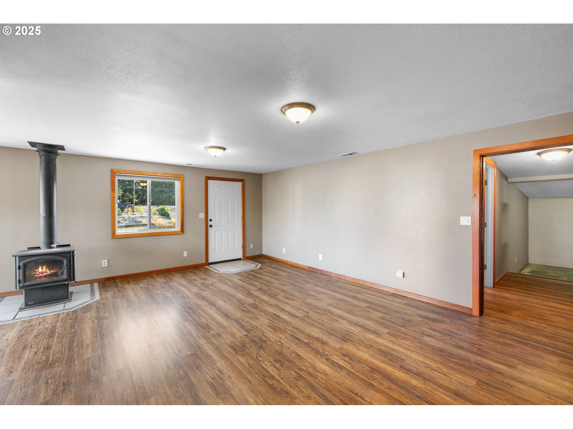 14001 South Union Mills Road Mulino, OR 97042 - Photo 4 of 48 a view of an empty room with wooden floor and a window
