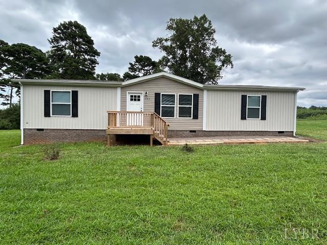 a white house that has a tree in front of it