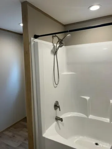 a bathroom with a shower and a sink