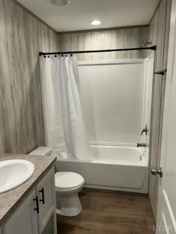 a bathroom with a toilet a sink and a bathtub