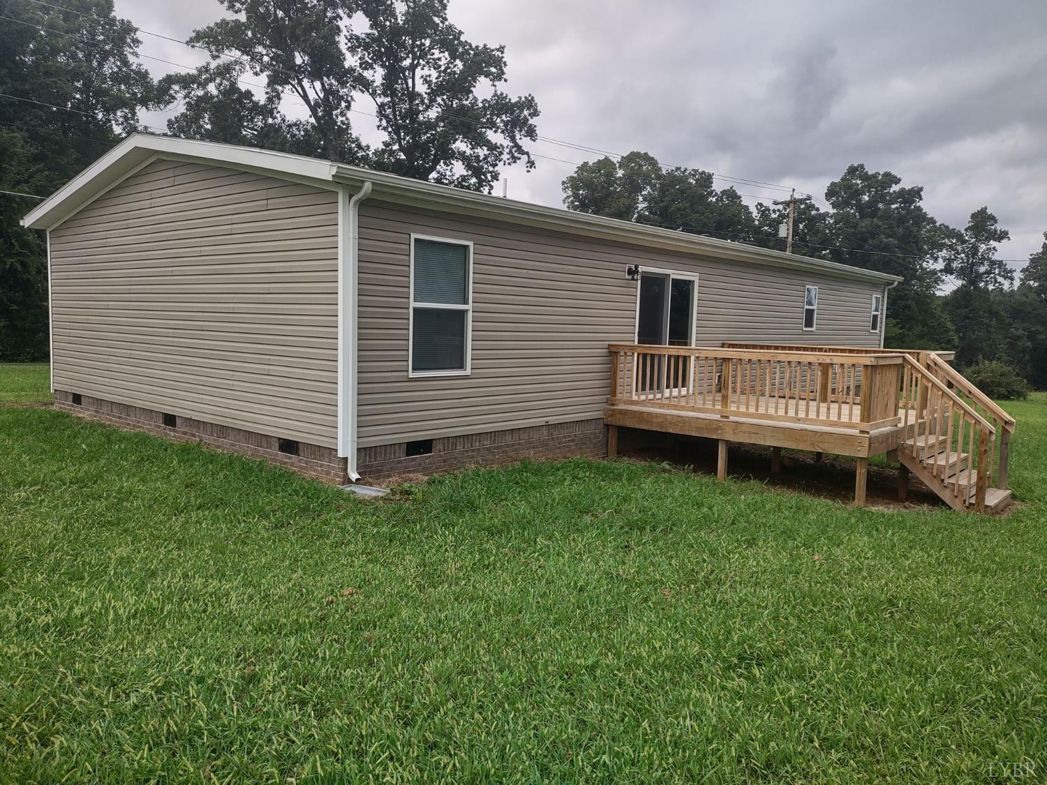 209 Lee Ford Camp Road Ridgeway, VA 24148 - Photo 19 of 19 a view of a house with a yard