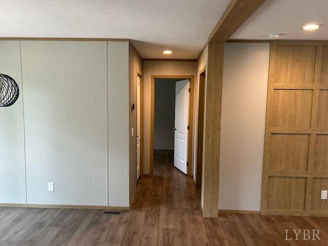209 Lee Ford Camp Road Ridgeway, VA 24148 - Photo 8 of 19 a view of empty room with wooden floor