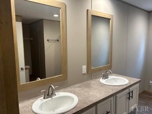 209 Lee Ford Camp Road Ridgeway, VA 24148 - Photo 10 of 19 a bathroom with a granite countertop sink and a mirror