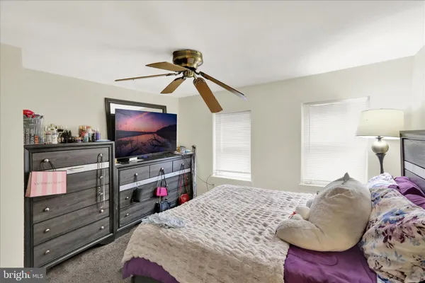a bedroom with a bed and lamp