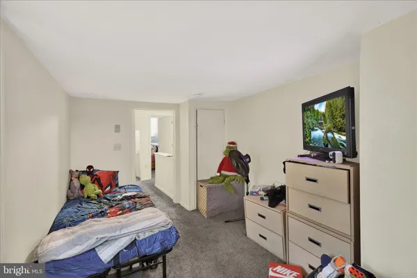 a view of a hallway with workspace and toys