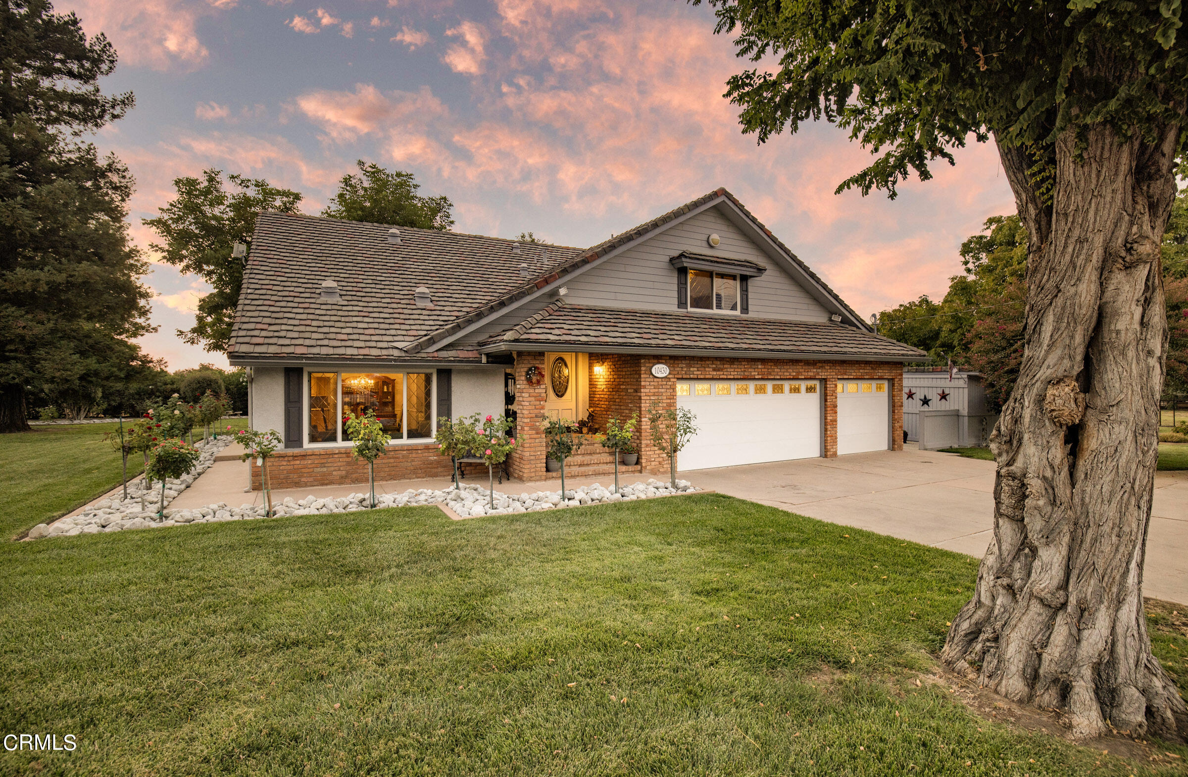 10430 Ojai Santa Paula Road Ojai, CA 93023 - Photo 23 of 25 a front view of a house with a yard and trees