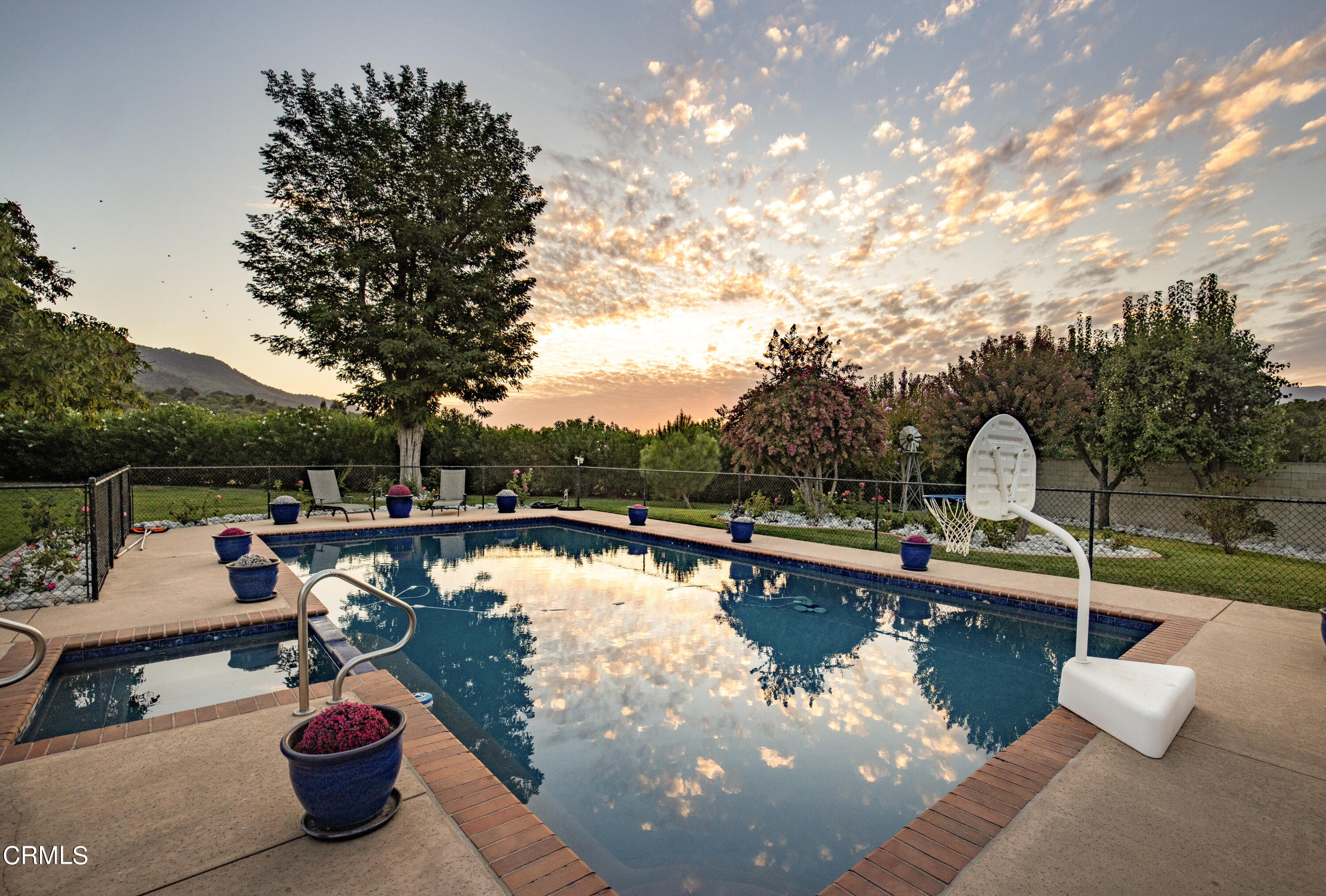 10430 Ojai Santa Paula Road Ojai, CA 93023 - Photo 6 of 25 a view of a lake with couches chairs and a lake view