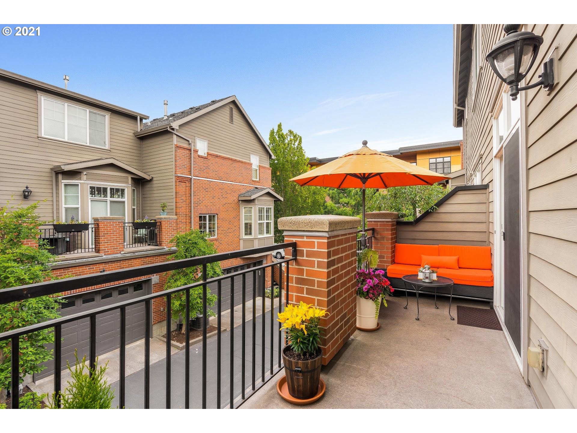2374 Northwest Raleigh Street Portland, OR 97210 - Photo 12 of 32 a balcony with an outdoor seating
