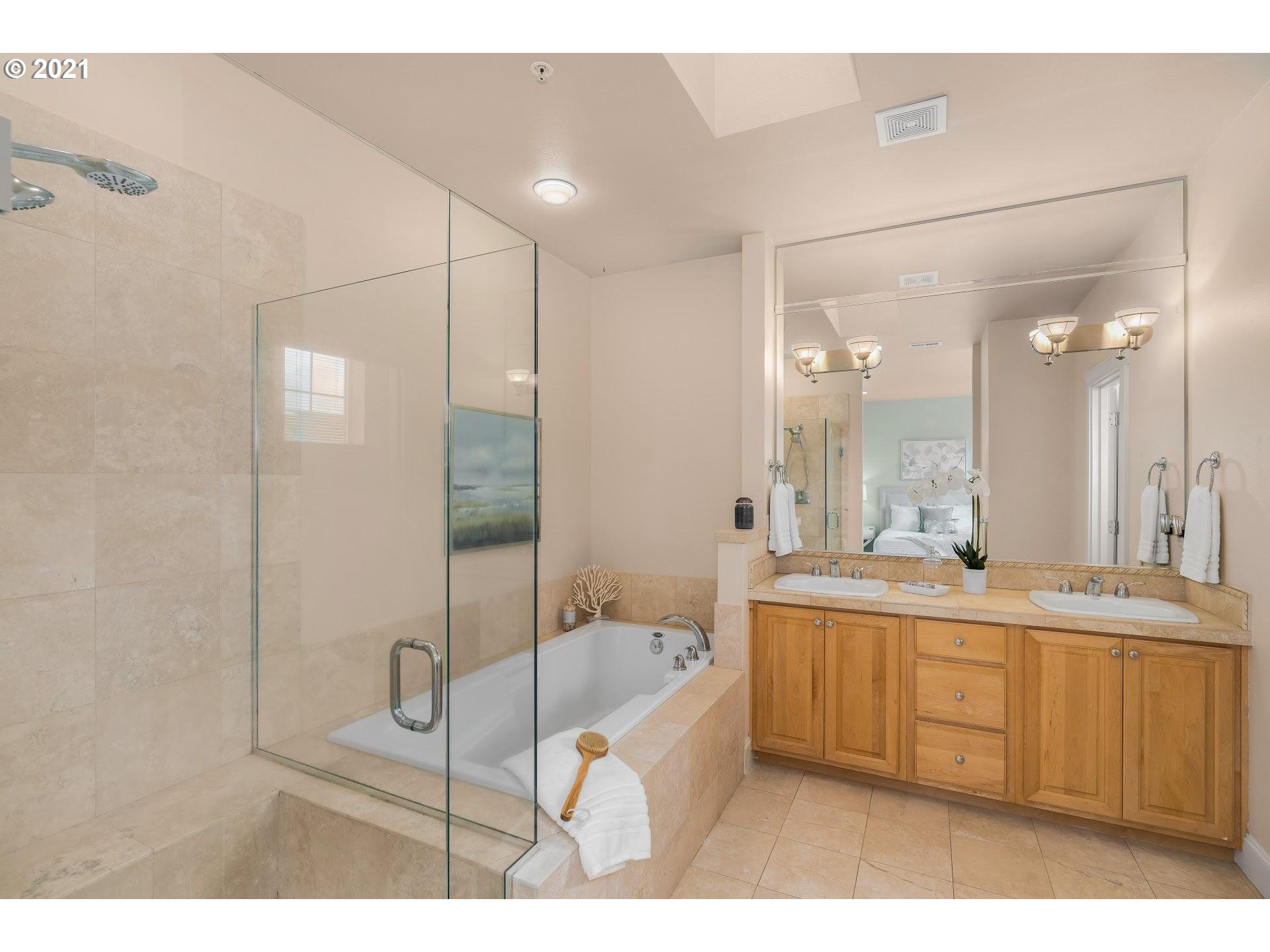 2374 Northwest Raleigh Street Portland, OR 97210 - Photo 15 of 32 a bathroom with a bathtub sink and mirror