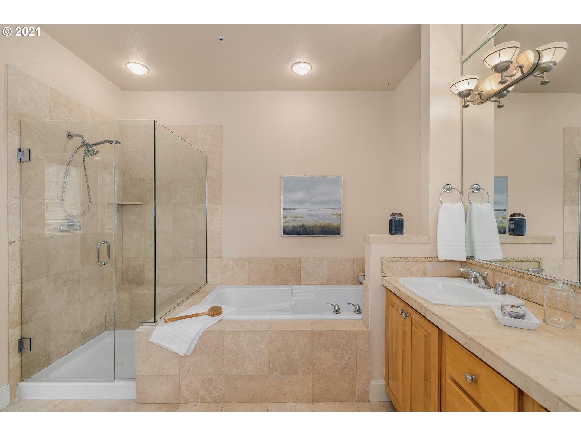 2374 Northwest Raleigh Street Portland, OR 97210 - Photo 16 of 32 a bathroom with a sink mirror and a shower