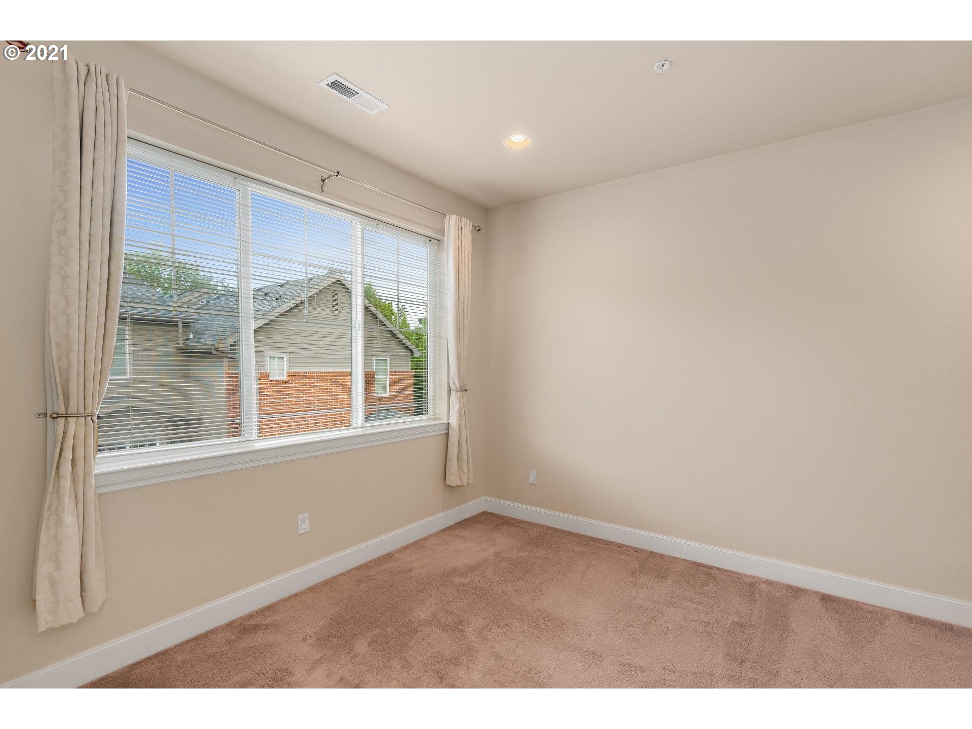 2374 Northwest Raleigh Street Portland, OR 97210 - Photo 17 of 32 a view of empty room with windows