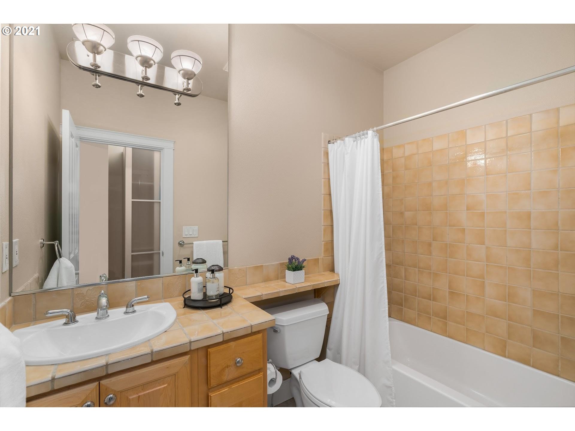 2374 Northwest Raleigh Street Portland, OR 97210 - Photo 19 of 32 a bathroom with a sink a toilet and shower