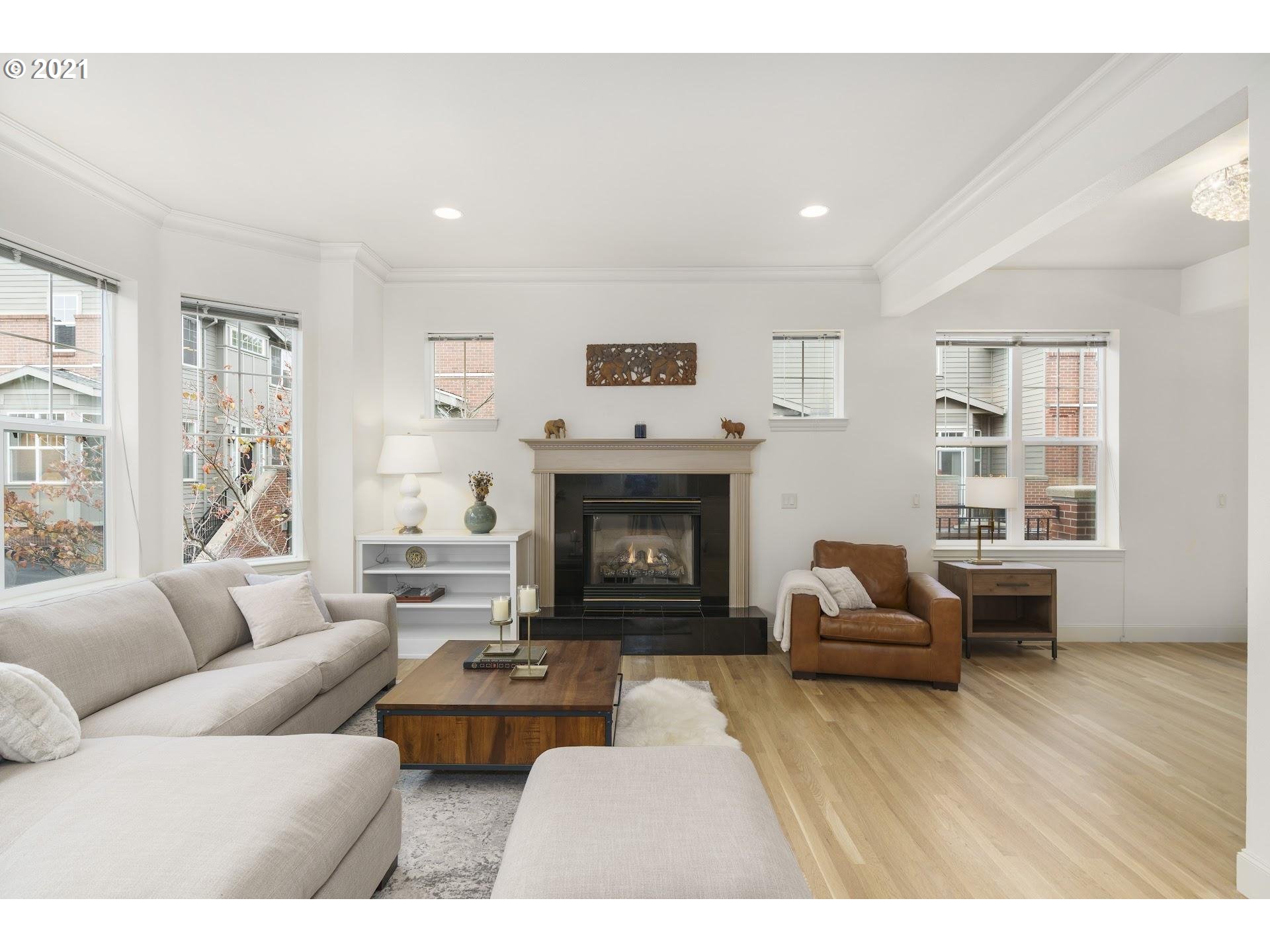 2374 Northwest Raleigh Street Portland, OR 97210 - Photo 4 of 32 a living room with furniture and a fireplace