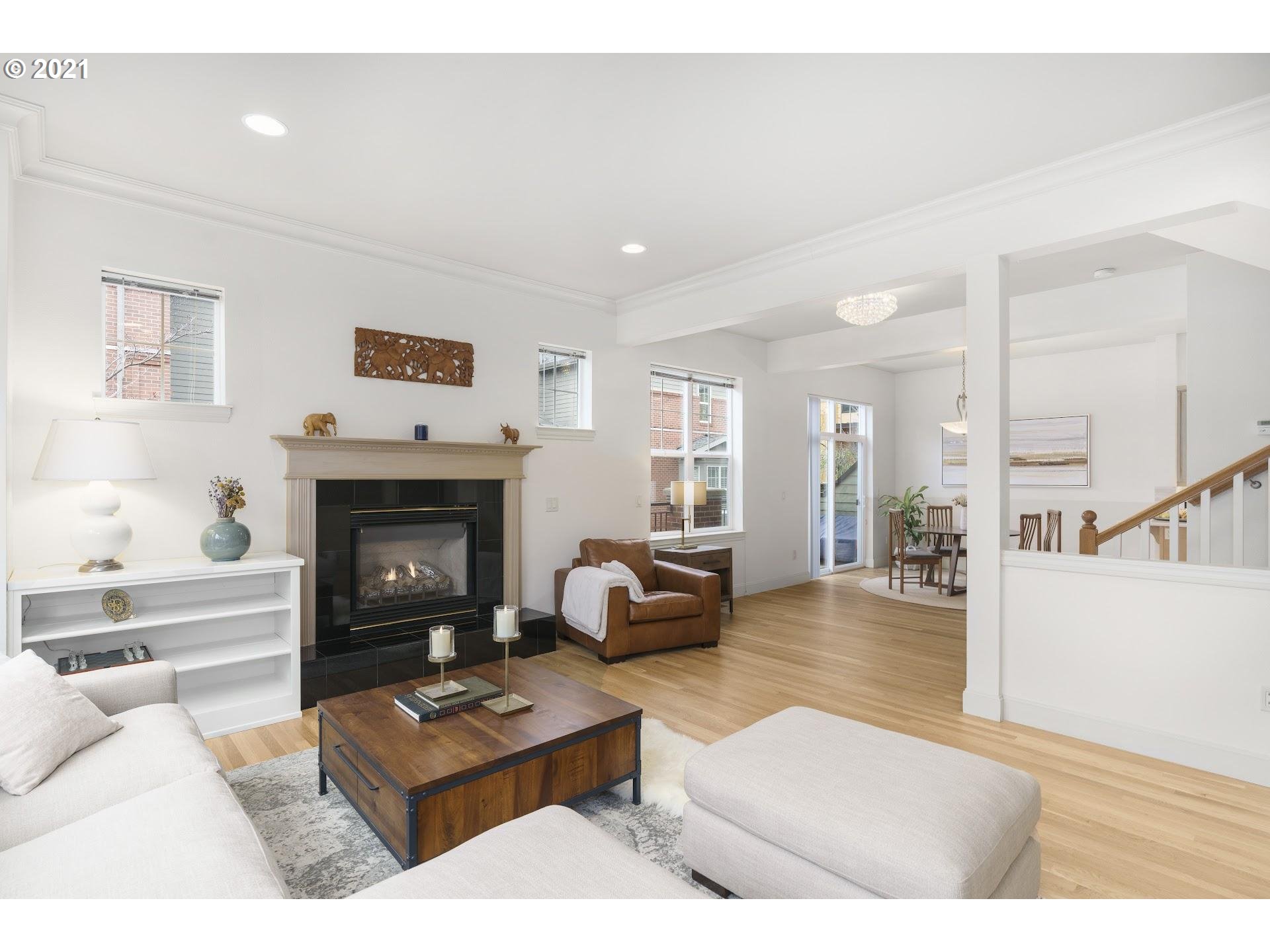2374 Northwest Raleigh Street Portland, OR 97210 - Photo 5 of 32 a living room with furniture and a fireplace