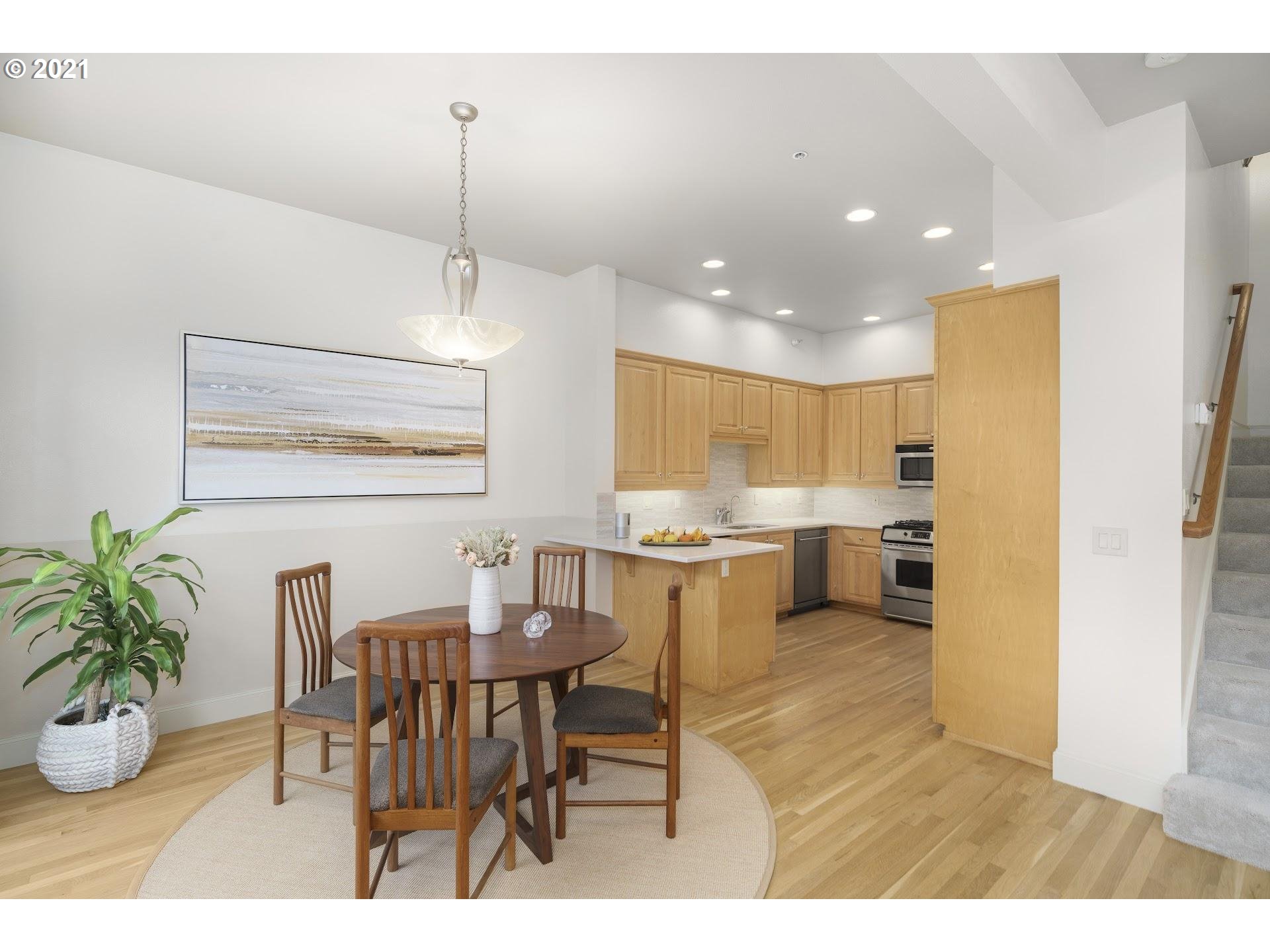 2374 Northwest Raleigh Street Portland, OR 97210 - Photo 7 of 32 a kitchen with a table and chairs